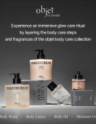 KUNDAL Objet Satin Glow Body Oil ápoló testolaj az intenzív hidratálásért illattal Glowing Orchard 100 ml