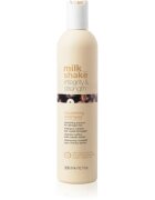 milk_shake® Integrity & Strength Nourishing Shampoo tápláló sampon a károsult hajra 300 ml