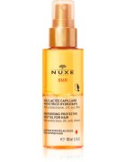 Nuxe Sun Moisturizing Protective Milky Oil For Hair védő olaj nap klór és sós víz által terhelt hajra 100 ml