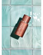 St.Tropez Sunlit Skin Bronzing Tint + Tan színezett önbarnító krém az arcra 1 db